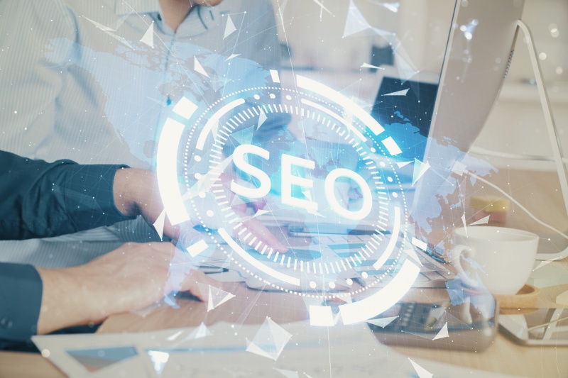 Illustration depicting the four pillars of E-E-A-T: Experience, Expertise, Authoritativeness, and Trustworthiness in SEO.