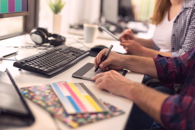 “SEO team conducting keyword research and website audit on a laptop”